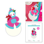 Spellbinders Festive Snowlady Etched Dies by Lolli & Grace cutting dies set. The left side shows the die cut outline of a snowman character in pink and blue with a red bow.