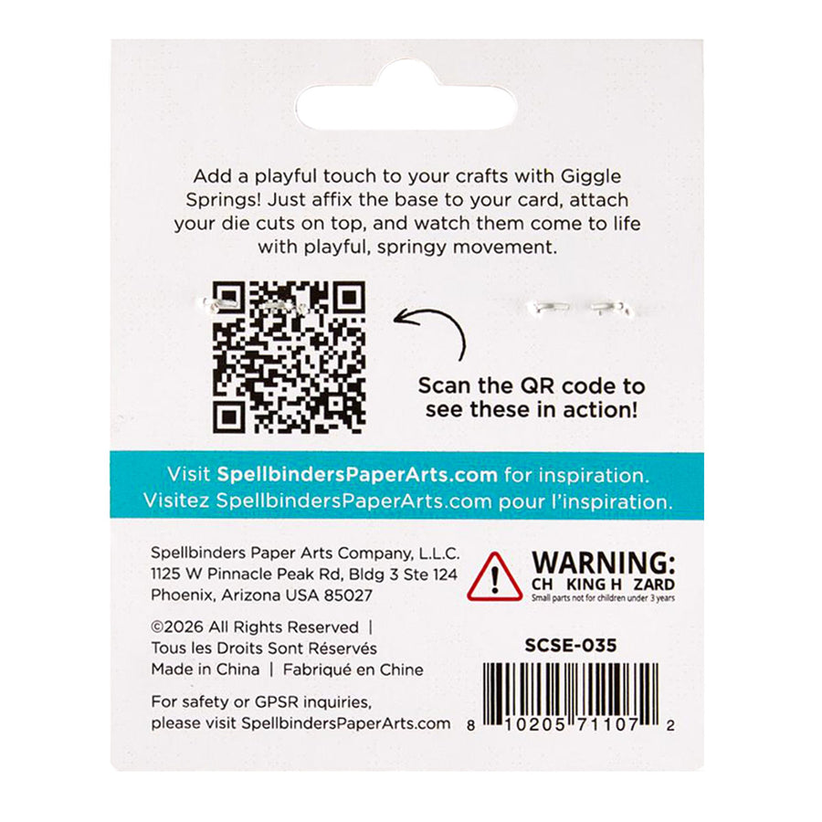 Back of a retail card for Spellbinders PaperArts Giggie Springs, showing product description, QR code, website, warning label, and barcode on a white card.