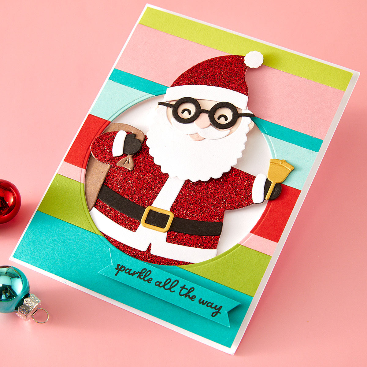 Christmas card with a stylized Santa Claus design on a pink background Spellbinders Spectacular Christmas collection