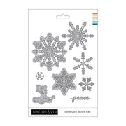 Concord & 9th Snowflake Season Dies set on a white backing card, featuring multiple silver metal snowflake and text dies including 'Let it snow' and 'peace'.