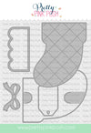 A craft die set by Pretty Pink Posh featuring a large quilted boot-shaped die, a smaller matching die, and a bow-shaped die, shown on a white background with the brand name and website. Pretty Pink Posh Stocking Gift Card Holder