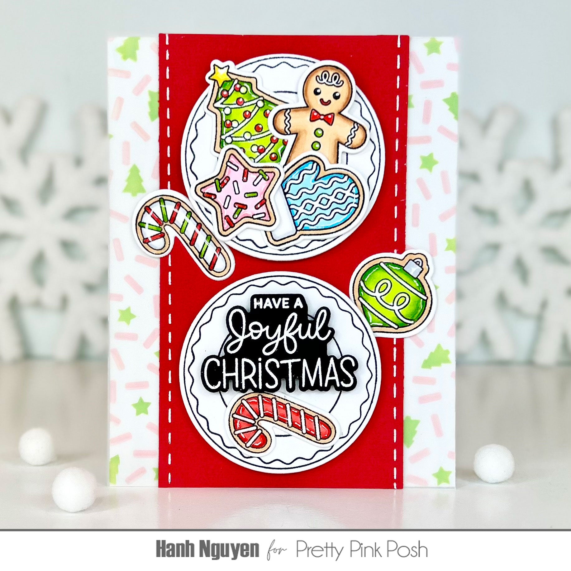 A handmade Christmas greeting card with a red and white background, decorated with gingerbread cookies, candy canes, a star, and ornaments. The card features the text 'HAVE A Joyful CHRISTMAS' in a black and white font.