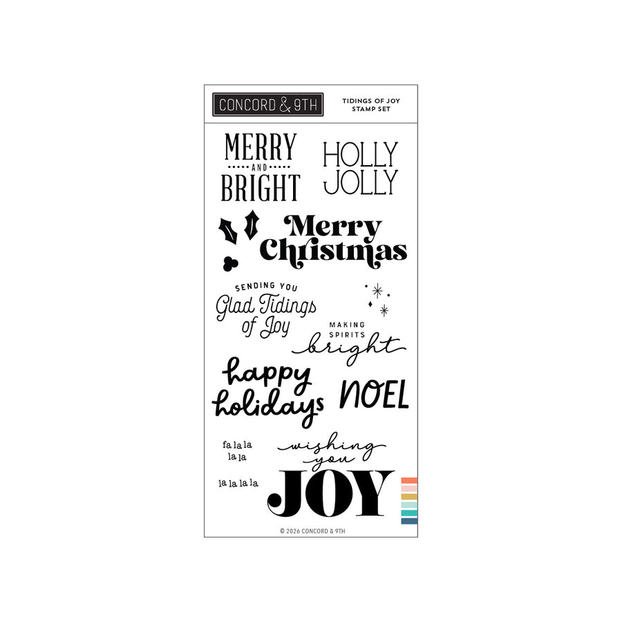 Concord & 9th Tidings of Joy Stamp Set featuring a collection of black holiday-themed die-cut and impression stamps on a white sheet, including 'Merry Christmas', 'Happy Holidays', and 'Joy', with a small multicolor accent strip at the bottom.