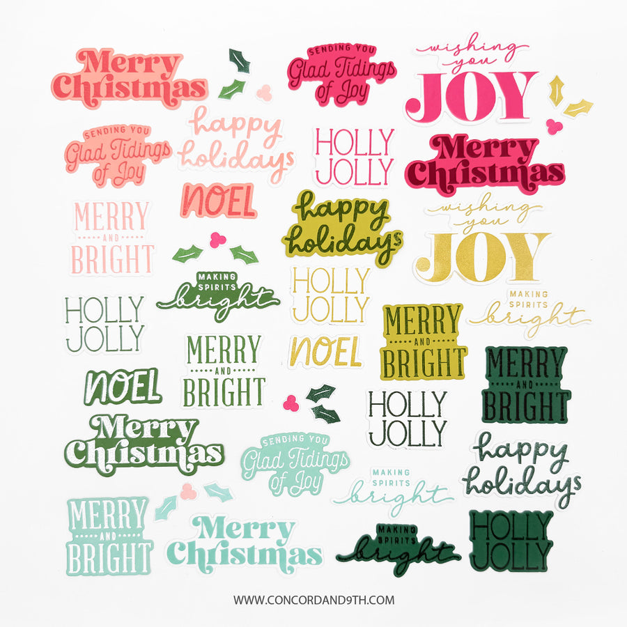 A sheet of Christmas typography designs featuring various holiday phrases like 'Merry Christmas', 'Happy Holidays', 'Holly Jolly', and 'Joy' in multiple colors including pink, green, yellow, and blue on a white background.