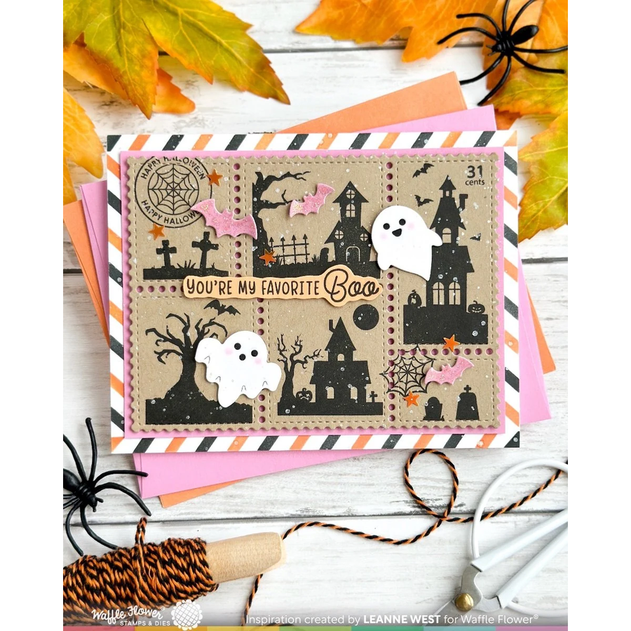 A Halloween-themed layered card with black haunted houses, ghosts, bats, and spiderwebs on a tan background, surrounded by orange, pink, and white striped paper and autumn leaves. The card reads 'You're My Favorite Boo' and shows '31 cents' in the top right corner.