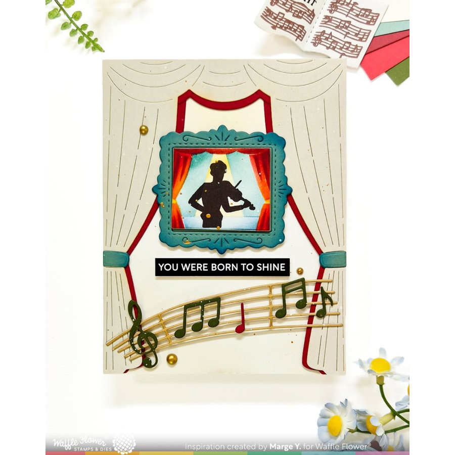 A handmade greeting card featuring a violinist silhouette framed in teal, with red curtains, musical notes on a staff, and the text 'YOU WERE BORN TO SHINE'.