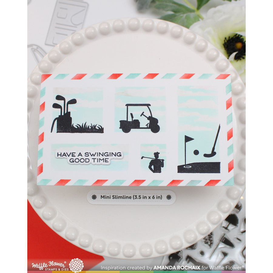 A greeting card featuring golf-themed illustrations and the phrase 'HAVE A SWINGING GOOD TIME' on a white plate, with a small label reading 'Mini Slimine (3.5 in x 6 in)'.