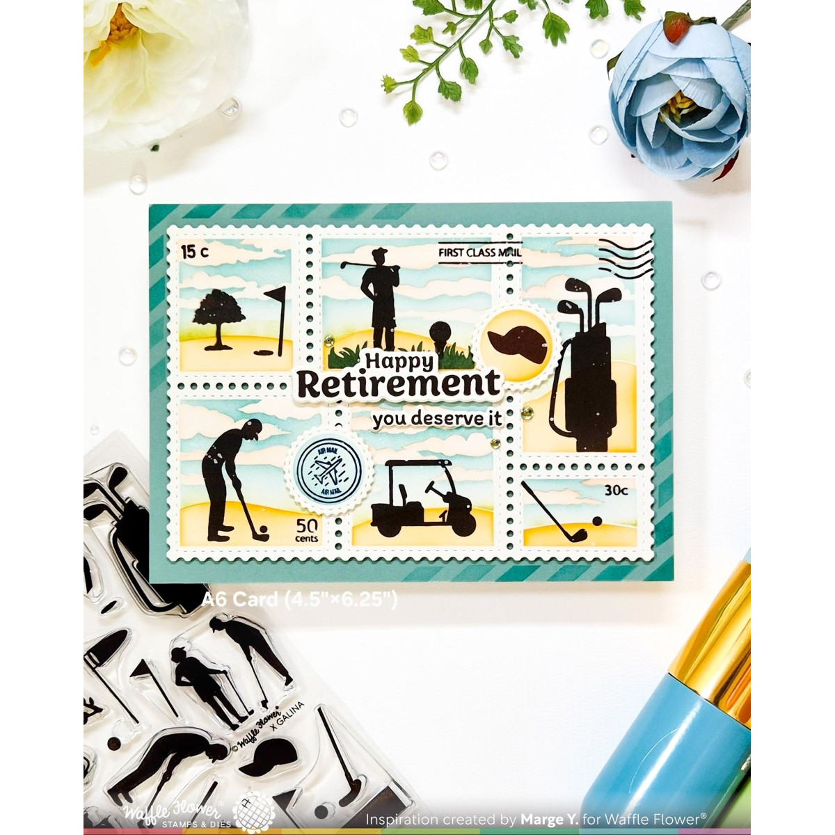 A rectangular ac card featuring postage-stamp-style golf illustrations and the text 'Happy Retirement you deserve it,' shown on a white background with craft stamps, flowers, and a paintbrush nearby.