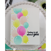 A rectangular white card with a colorful balloon design and the phrase 'Today is all about you' in black script, displayed on a white beaded plate. The card appears to be the product, with a small 'MyLifeStamps' mark visible at the bottom.