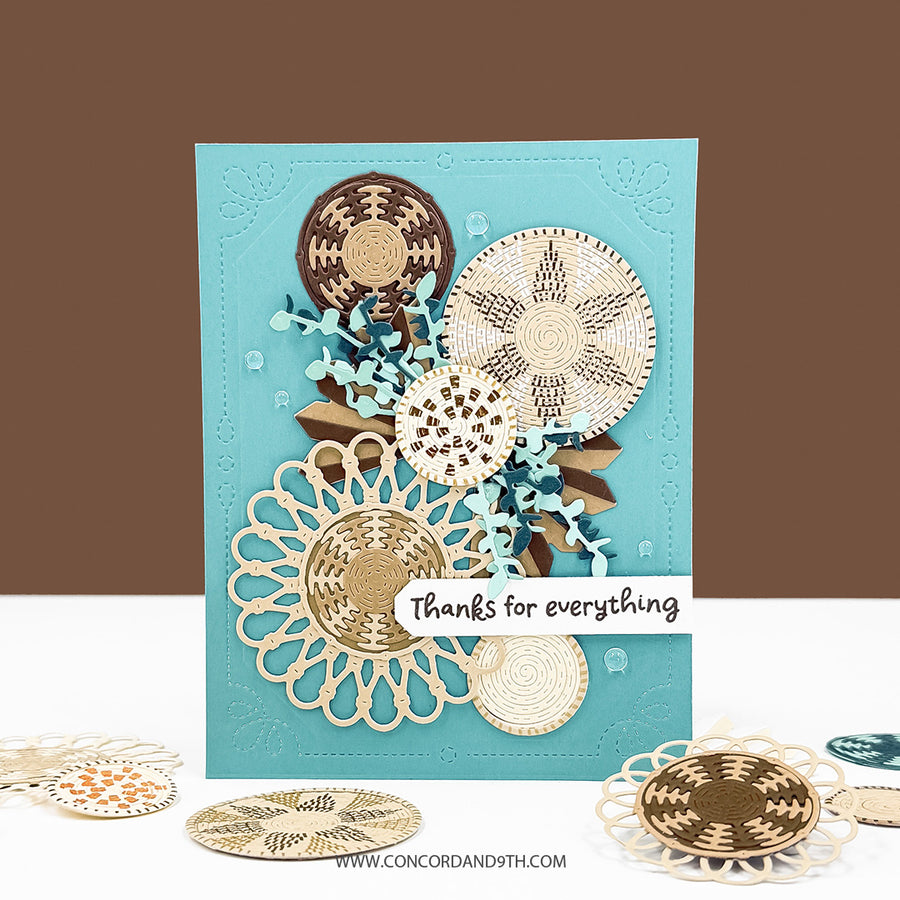 A handmade layered greeting card with a turquoise background and intricate laser-cut floral and circular patterns in beige, brown, and light blue. A small white banner on the front reads 'thanks for everything'.