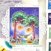 Illustration of a peaceful outdoor scene with trees, hammock, and picnic setup on a decorative card.