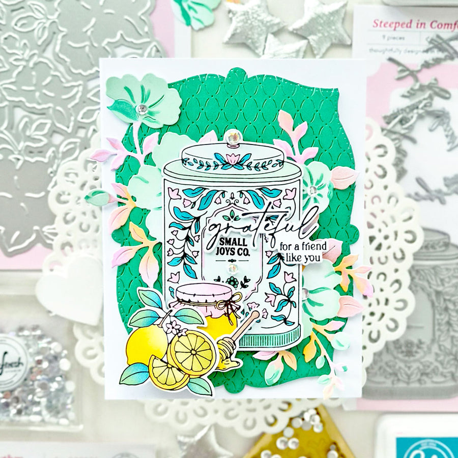 A handmade greeting card featuring a lemon-themed illustration with a jar labeled 'Small Joys Co.' and the phrase 'Grateful for a friend like you.