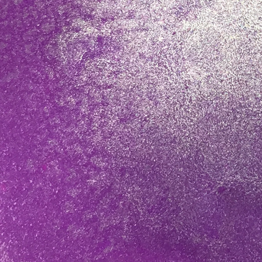 A close-up of a textured purple surface with a metallic silver sheen, showing a gradient from deep purple on the left to lighter silvery purple on the right. Lindy's Gang Prima Donna Purple Starburst Spray